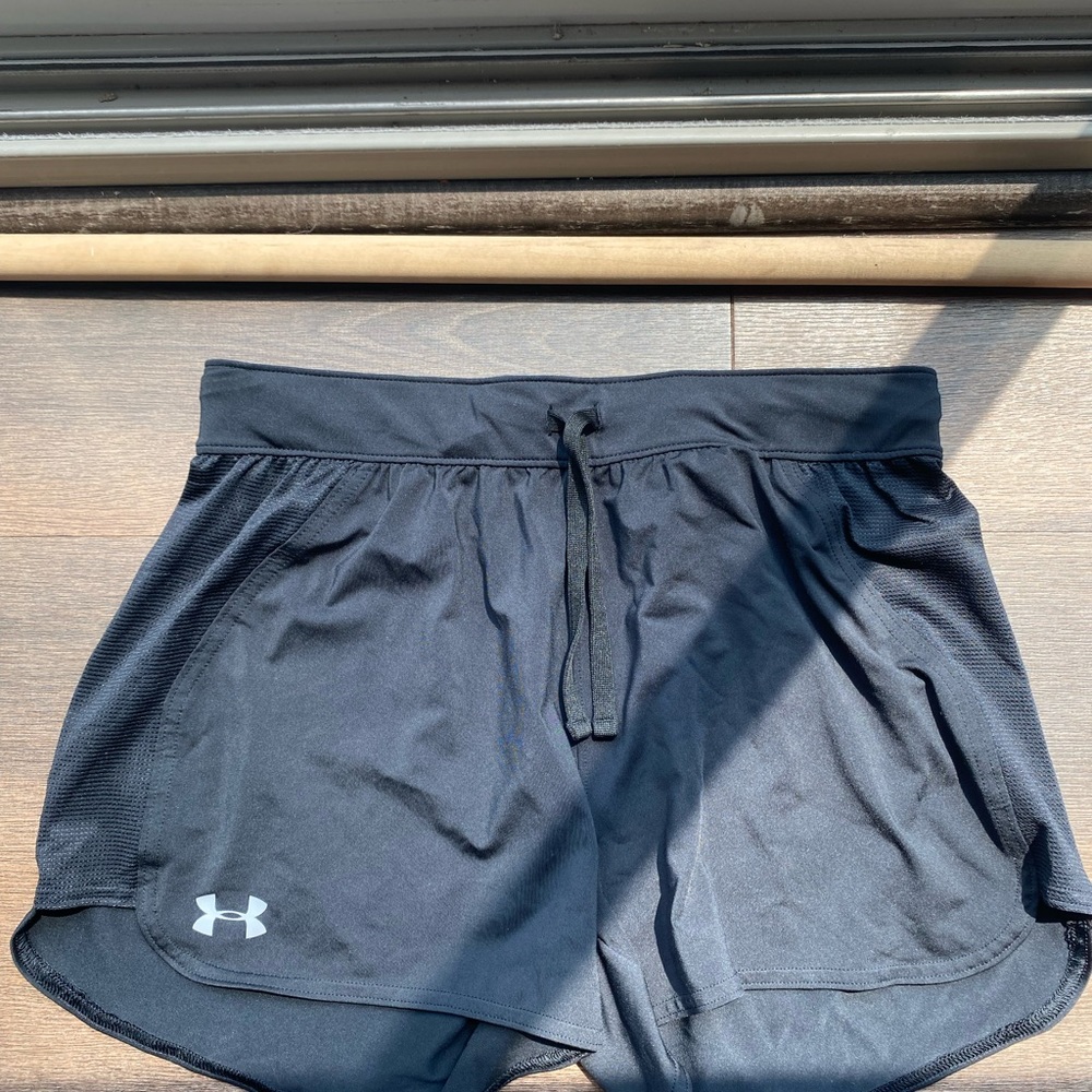 Women’s Black under armor shorts. Size S. Has tie strings.